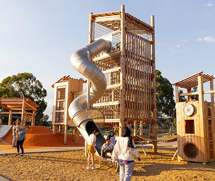 View of a large playground with climbing towers